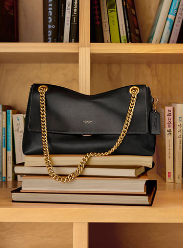 Bolsas de hombro para mujer Coach